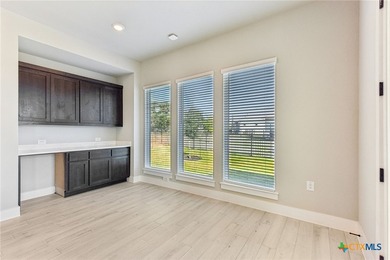 Auburn Plan with upgraded kitchen, quartz countertops, dry bar - photo 13