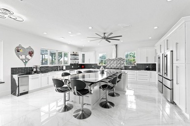 Custom Estate lakefront home in PGA Village. Experience refined - photo 7