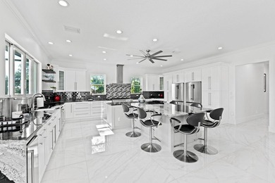 Custom Estate lakefront home in PGA Village. Experience refined - photo 9