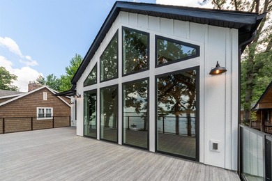 Welcome to an extraordinary lakeside retreat on the coveted - photo 6