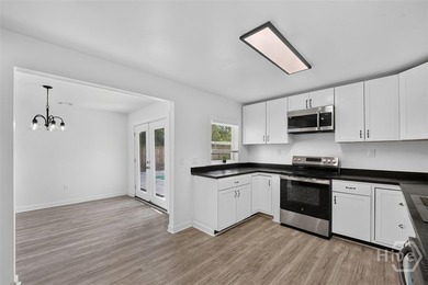 Where else can you own a beautifully updated 4-bedroom, 2 bath - photo 9