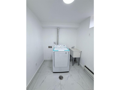 Welcome to this beautifully renovated one-family home with an - photo 21