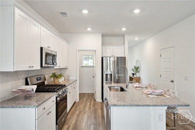 This cozy single-story Palmetto home design features an open - photo 6