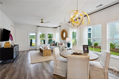This cozy single-story Palmetto home design features an open - photo 8