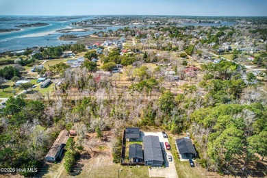 This nearly half-acre wooded lot in Snug Harbor offers the - photo 8