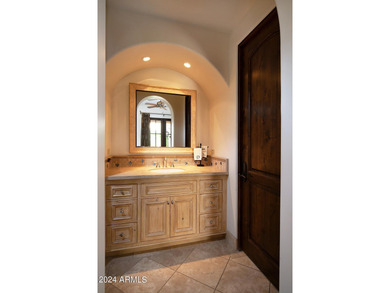 This timeless styled Spanish Colonial home rests in guard gated - photo 29