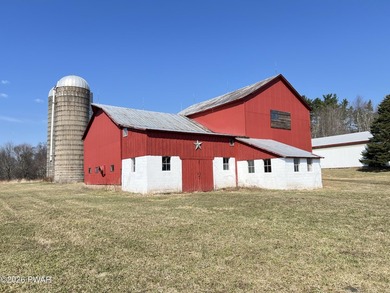 This property features a well-maintained barn roughly 12,000 sq - photo 3