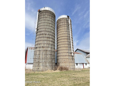 This property features a well-maintained barn roughly 12,000 sq - photo 8