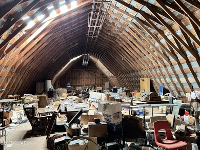This property features a well-maintained barn roughly 12,000 sq - photo 9