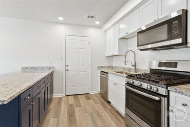 Welcome to this beautifully renovated home, where quality - photo 8