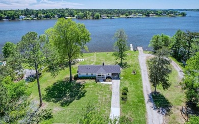 This Lake Home is truly a rare gem! Nestled along 165 Feet of - photo 1