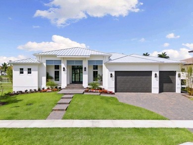 Just completed! New construction waterfront residence on Marco - photo 1
