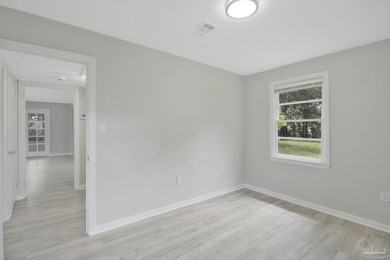 Completely renovated and move-in ready. This home features an - photo 21