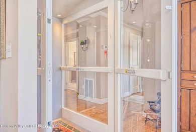 Perched on a commanding 4.5-acre hilltop, this magnificent brick