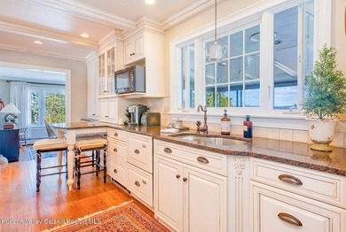 Perched on a commanding 4.5-acre hilltop, this magnificent brick