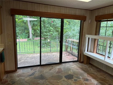 One of the largest condos in White Oak Station features a beamed - photo 15