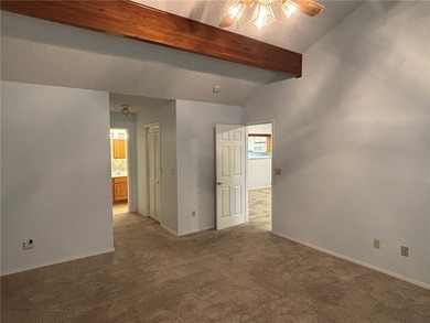 One of the largest condos in White Oak Station features a beamed - photo 18