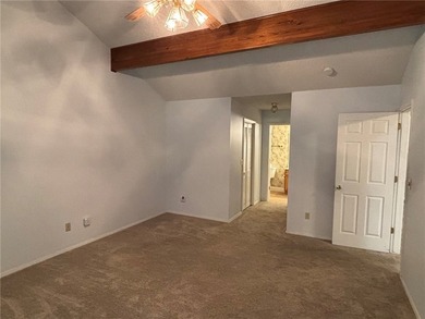 One of the largest condos in White Oak Station features a beamed - photo 19