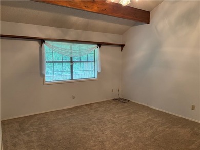 One of the largest condos in White Oak Station features a beamed - photo 20