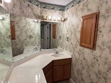 One of the largest condos in White Oak Station features a beamed - photo 23
