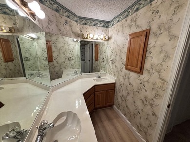 One of the largest condos in White Oak Station features a beamed - photo 24