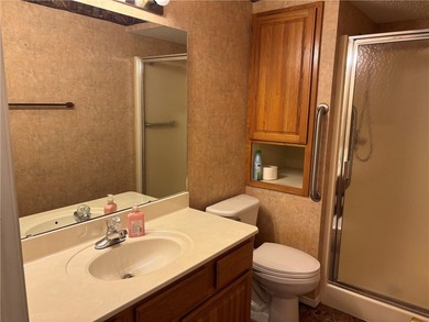One of the largest condos in White Oak Station features a beamed - photo 28