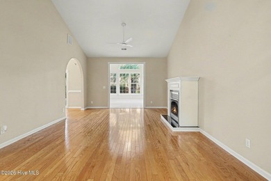 The centerpiece of 868 Sandpiper Bay Dr SW is a fireplace. The - photo 3