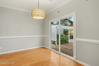 The centerpiece of 868 Sandpiper Bay Dr SW is a fireplace. The - photo 8