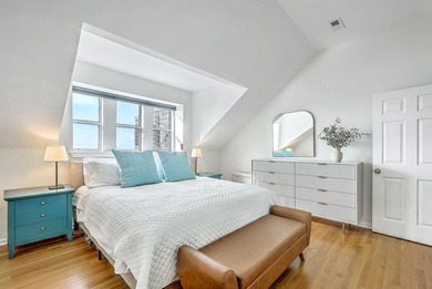 Move-in ready, tastefully updated 2-story, top floor unit in the