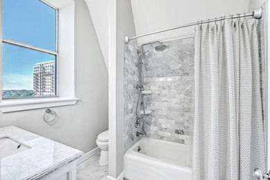 Move-in ready, tastefully updated 2-story, top floor unit in the