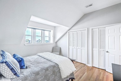 Move-in ready, tastefully updated 2-story, top floor unit in the