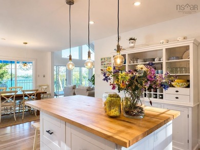 Welcome to an extraordinary turnkey waterfront retreat, where - photo 18
