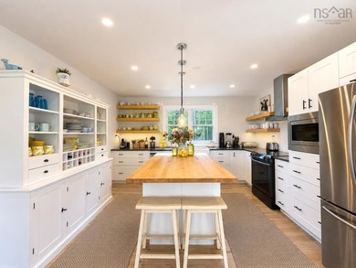 Welcome to an extraordinary turnkey waterfront retreat, where - photo 20