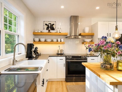 Welcome to an extraordinary turnkey waterfront retreat, where - photo 21