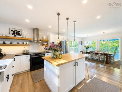 Welcome to an extraordinary turnkey waterfront retreat, where - photo 24