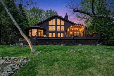 Splendor on the lake! A beautiful manicured, level lot on a - photo 2
