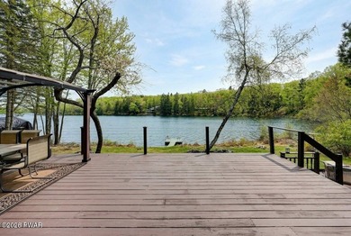Splendor on the lake! A beautiful manicured, level lot on a - photo 3