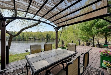 Splendor on the lake! A beautiful manicured, level lot on a - photo 8