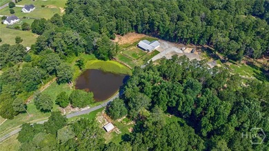 Set on 19.52 private acres, this thoughtfully designed 3-bedroom - photo 2