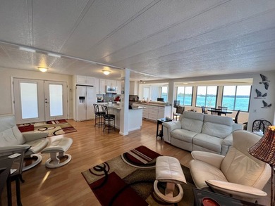 This incredible riverfront home at 327 3rd St Dr W #11 in - photo 8