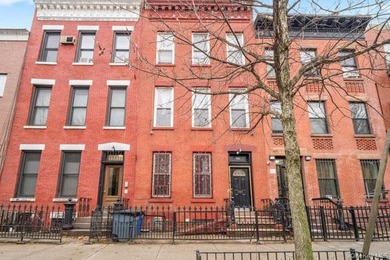 Welcome to 584 Sterling Place, a classic three-family townhouse - photo 1