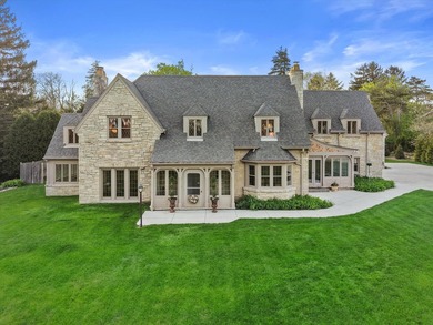 This stately stone Tudor is located east of Lake Drive, just - photo 2