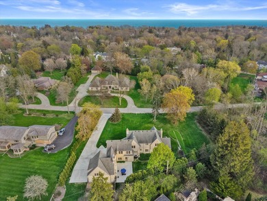 This stately stone Tudor is located east of Lake Drive, just - photo 3