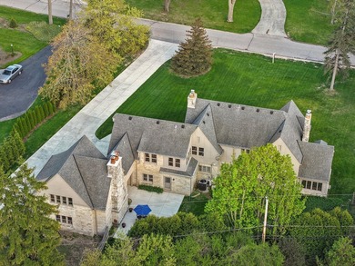 This stately stone Tudor is located east of Lake Drive, just - photo 4
