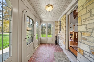This stately stone Tudor is located east of Lake Drive, just - photo 5