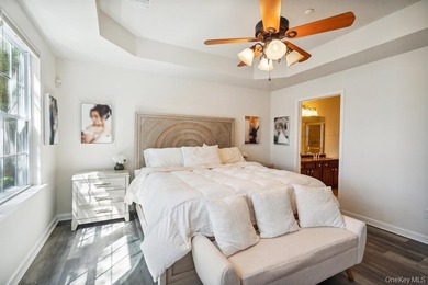 Welcome to this highly sought-after first-floor end unit located - photo 16