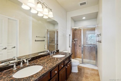 Welcome to this highly sought-after first-floor end unit located - photo 17