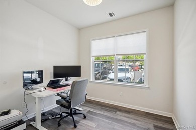 Welcome to this highly sought-after first-floor end unit located - photo 18