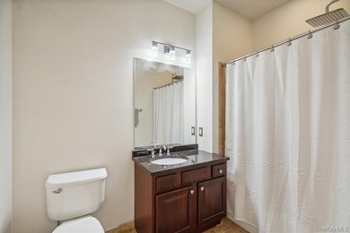 Welcome to this highly sought-after first-floor end unit located - photo 19