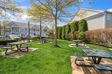 Welcome to this highly sought-after first-floor end unit located - photo 22
